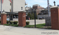 combination-of-metal-fence-and-brick-pillars-with-decorative-lights