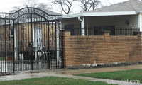 brick-fence-with-stylish-metal-gates