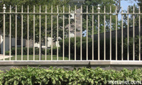 metal-fence-on-stone-foundation