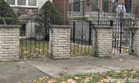 metal-fence-with-decorative-brick-columns