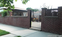 older-brick-fence-with-metal-gate