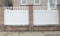 white-panels-brick-columns-fence