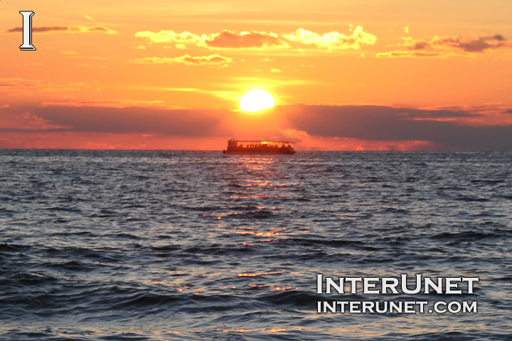 boat-on-sunset-in-clouds