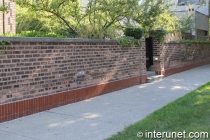brick fence with concrete sills on top