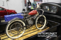 old-moped-with-pedals-on-1955-Chevrolet-pickup-truck