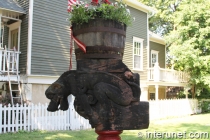 wood-sculpture-animal-with-flowers-pot