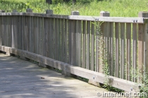 lumber-fence-on-wood-bridge 