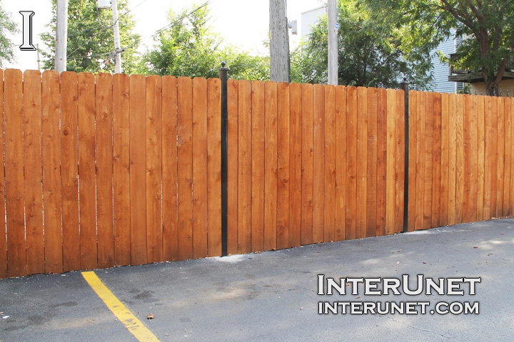 stained-cedar-fence-on-metal-posts