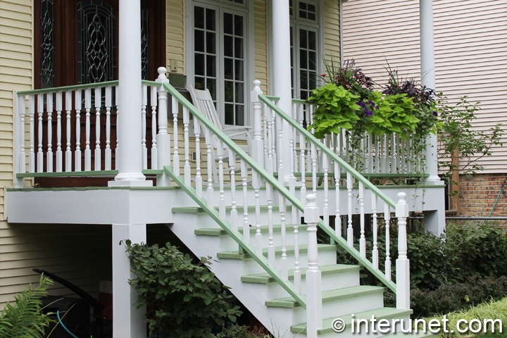 wood-porch-painted-white-and-decorated-with-plants