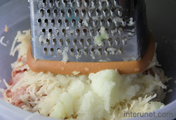 shredding-potato-with-onions-and-garlic