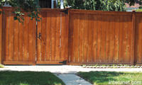 stained-wood-fence-with-gate