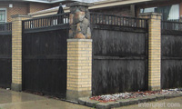 fence-with-stone-extension-on-brick-pillar